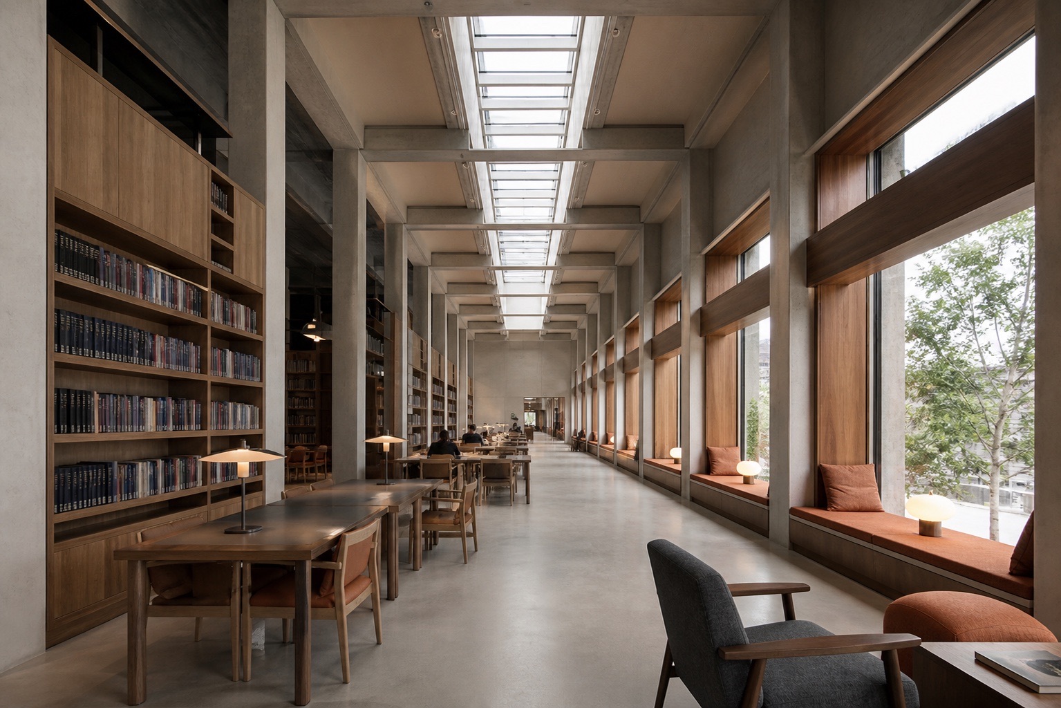 Fictional public library reading hall with repeated concrete bays, timber shelving, and skylights